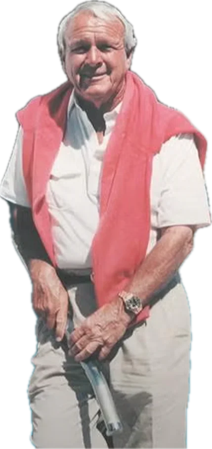 Arnold Palmer, smiling, with a sweater over his shoulders