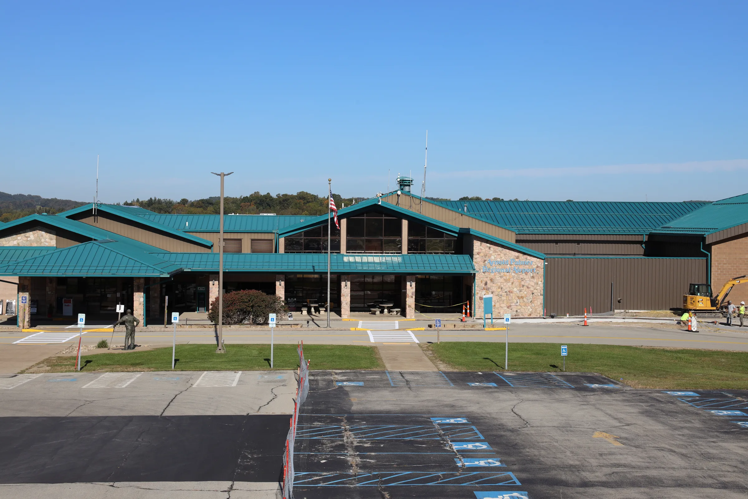 The front of the terminal at Arnold Palmer Regional Airport, across the parking lot